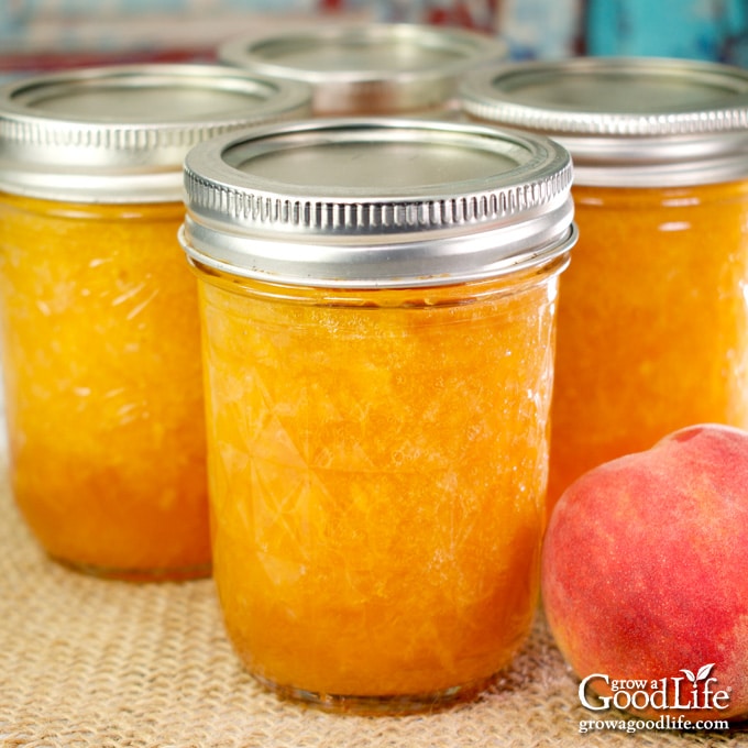 jars of peach jam on a table