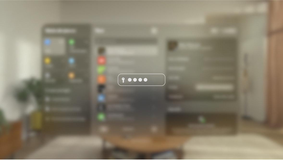 La vue sur l’Apple Vision Pro pendant la saisie d’un mot de passe, telle que vue par une personne regardant un écran recopié. La vue est floue et une image indique que l’utilisateur est en train de saisir un mot de passe.