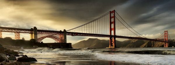 bridge,city,water,sky,evening,suspension bridge