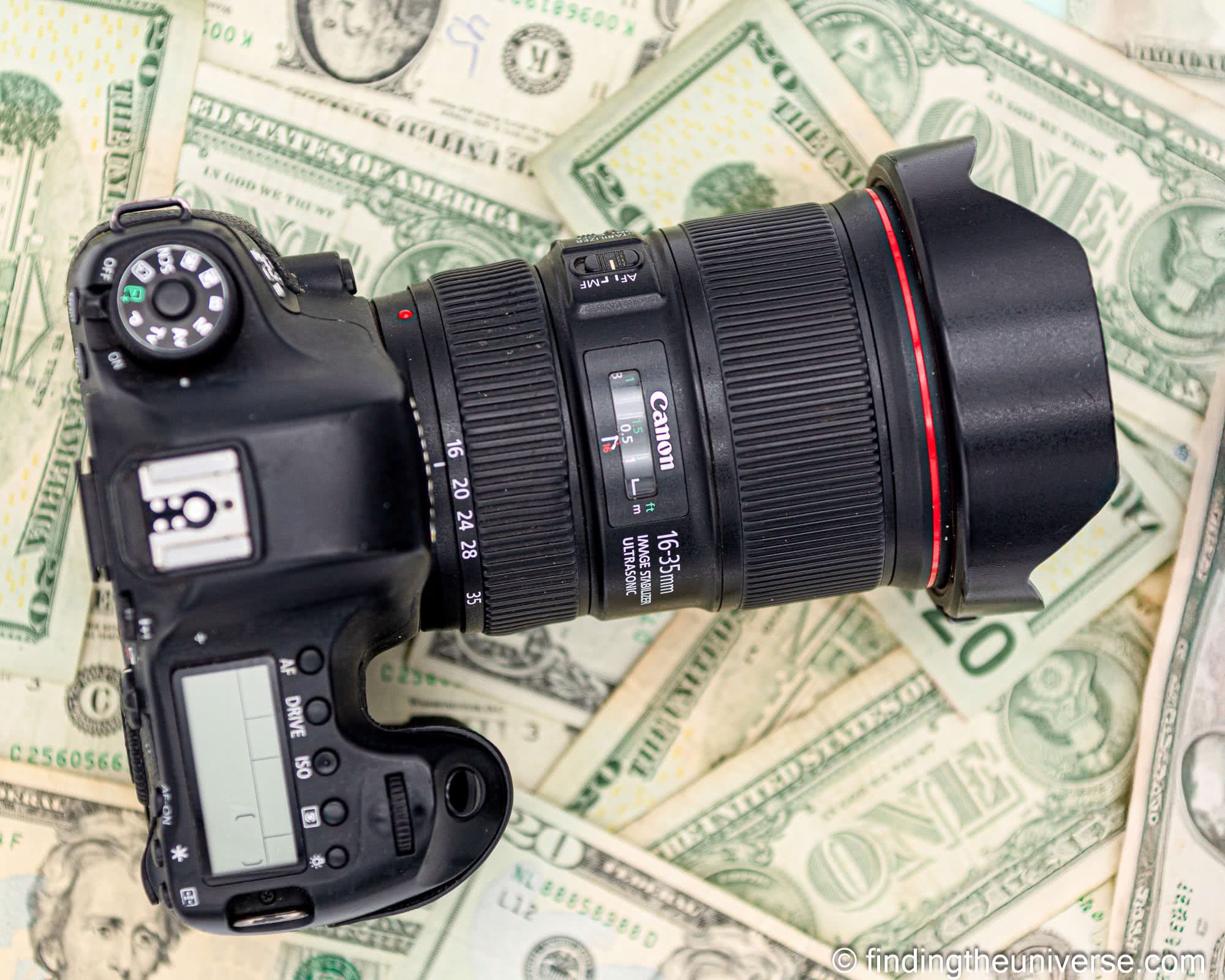 Camera on money by Laurence Norah