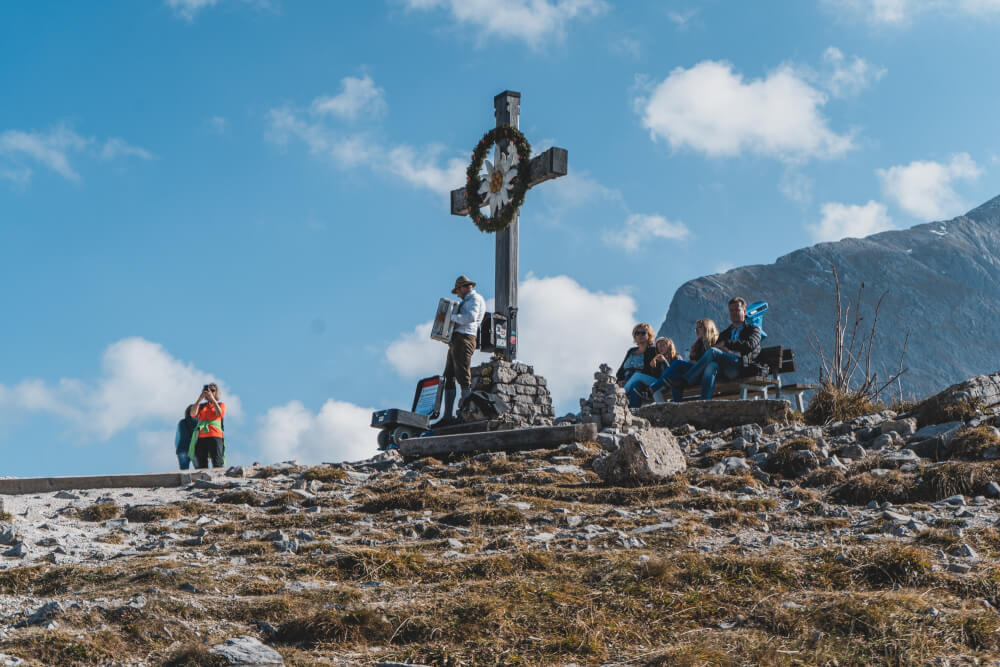 Eagle's Nest cross with an accordion player