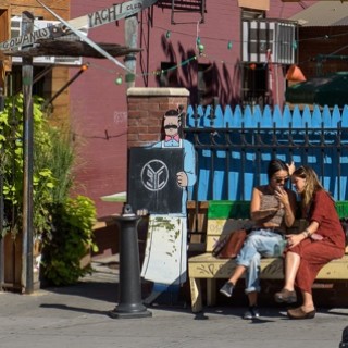 women outside of gowanus yacht club