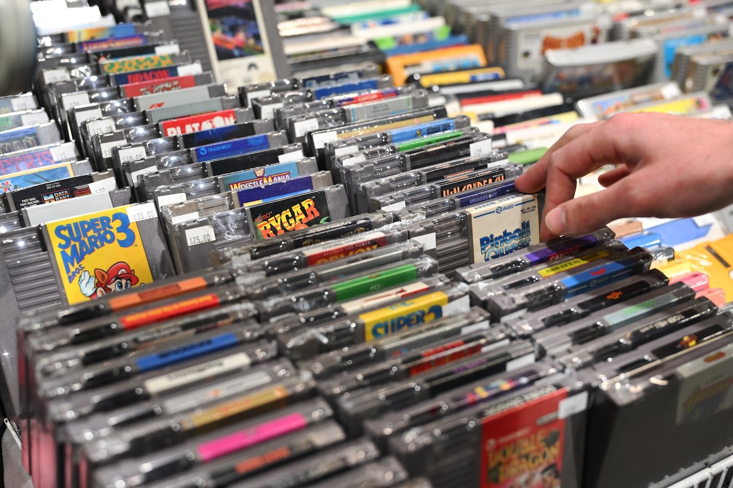 Several rows of NES cartridges from a retro games expo.