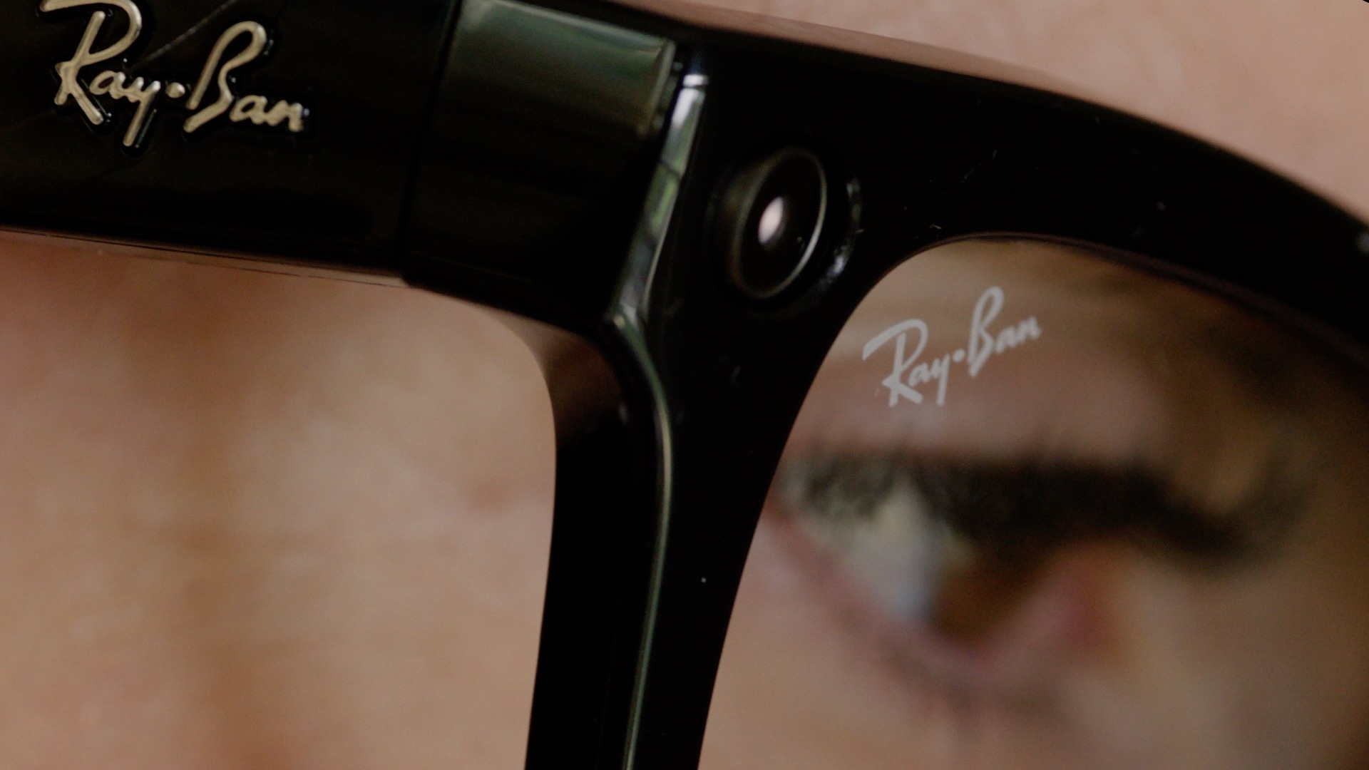 Closeup of black Ray-Ban Meta Glasses being worn.