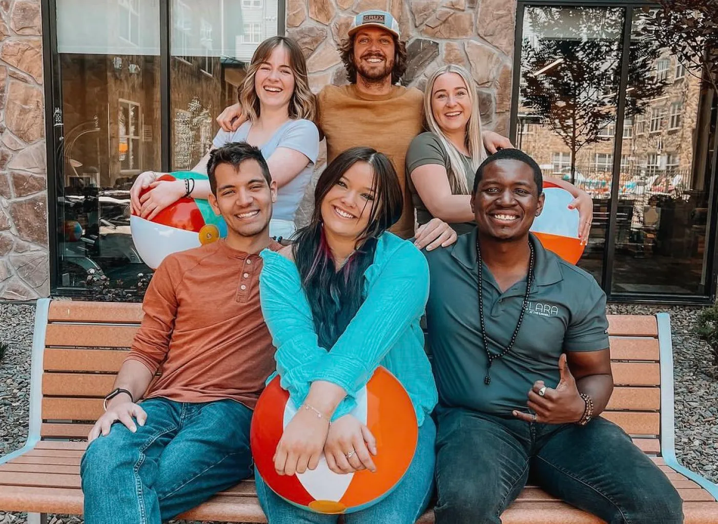 diverse group of on-site employees smiling 