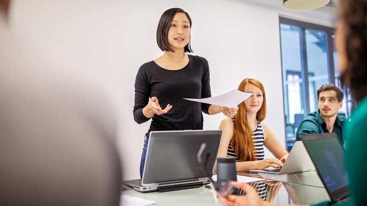 Photo of a teacher presenting to a class