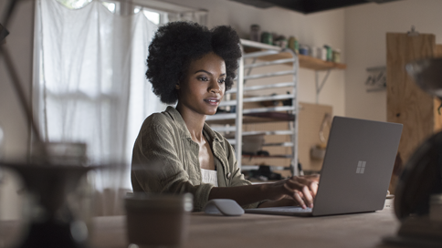 Woman using a local experience pack on a PC