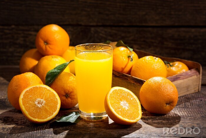 Poster Orangen und ein Glas Saft