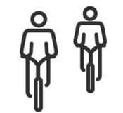 Icon Zwei BikerInnnen fahren nebeneinander Fahrrad