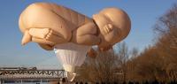 Spektators look on as hot air balloon ‘Baby You’ takes off for a flight over Warsaw, Poland, in a promotional event of the Polish cultural magazine ‘Przekroj’, December 13, 2024. (Photo by Wojtek RADWANSKI / AFP)