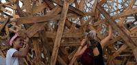 People write over a creation by German sculptor Martin Steinert during the 15th Havana Art Biennial, Havana, Cuba, November 15, 2024. REUTERS/Alexandre Meneghini Reuters-3.RC2W5BAQOGRS.JBH