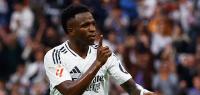 Soccer Football - LaLiga - Real Madrid v Osasuna - Santiago Bernabeu, Madrid, Spain - November 9, 2024 Real Madrid's Vinicius Junior celebrates scoring their fourth goal and completes his hat-trick REUTERS/Susana Vera