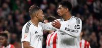 TOPSHOT - Real Madrid's French forward #09 Kylian Mbappe is comforted by Real Madrid's English midfielder #05 Jude Bellingham after failing to score from the penalty spot during the Spanish league football match between Athletic Club Bilbao and Real Madrid CF at the San Mames stadium in Bilbao on December 4, 2024. (Photo by ANDER GILLENEA / AFP)