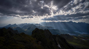 Bilder Norwegen Berg Wolke Lichtstrahl  Natur