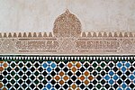 Frieze of stucco decoration in the galleries, with tile decoration below