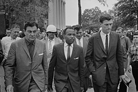 Doar (right) and U.S. marshals escorting James Meredith to class at the University of Mississippi