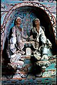 Sculptures in a niche above a main Buddha figure, Mogao cave 27, High Tang