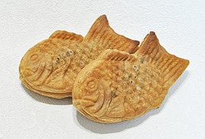 Two fish-shaped, somewhat flat pastries called taiyaki