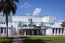 A white and pale green theater building