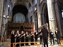 choir standing in a cathedral nave