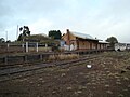 Nimmitabel railway station, closed in 1986. Looking south towards Bombala from the goods shed. The buildings are not maintained and are crumbling