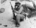 A Navajo Code Talker relays a message on a field radio. The code talkers served in the South Pacific during World War II and were kept a secret until 1968 when the Navajo code was finally declassified.