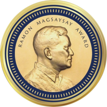 Medallion with an embossed image of Ramon Magsaysayl facing right in profile.