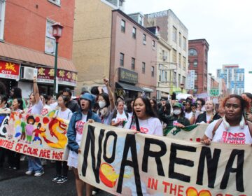 People march against the proposed new 76ers arena near Philadelphia's Chinatown neighborhood