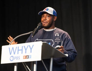 Terrill Haigler speaks behind a podium