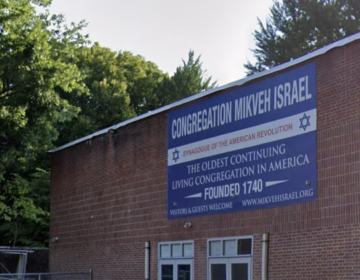 a sign on the building for Mikveh Israel