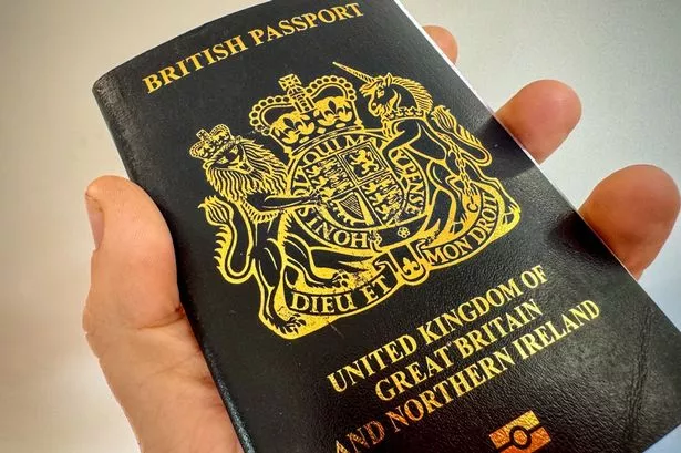 A man holds a post-Brexit United Kingdom issued passport 