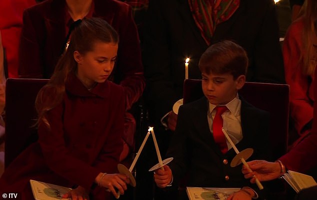 A sweet moment from the start of the service showed Princess Charlotte lighting her younger brother Prince Louis's candle