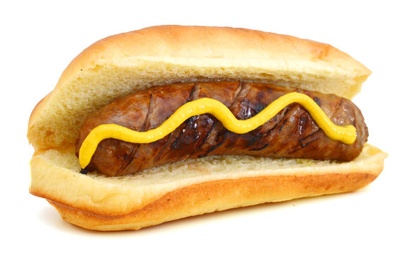 Grilled Bratwurst with mustard on bun. Isolated.