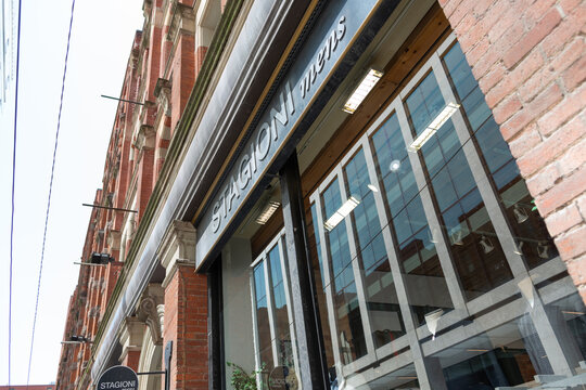 exterior building facade and sign of Stagioni Mens, a clothing store, located at 43 Colborne St/Ln in downtown Toronto, Canada