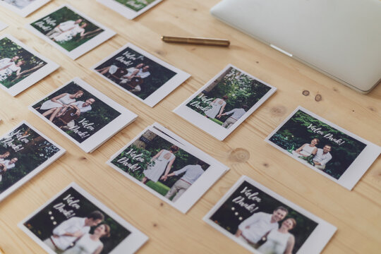 Wedding thank you cards of a newly married couple laid out on a desk