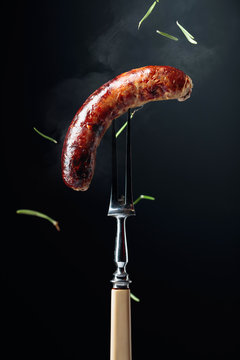 Grilled Bavarian sausage with rosemary.