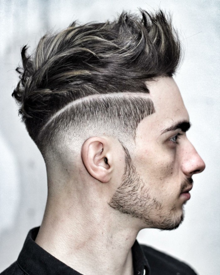 kreative gestaltung von männerfrisuren, undercut, mit einer nackten linie am kopf, die langes vom kurzen haar trennt, bart und haarstil kombinieren