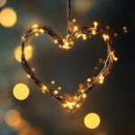 Free download Love Wallpaper HD with a simple, elegant heart design made from string lights, glowing warmly in a darkened room, symbolizing love and warmth.