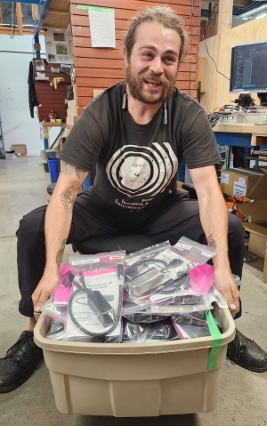 Stu lifting the giant box of bad batch Phaserunners for low voltage use, all passed QC and ready for clearance sale