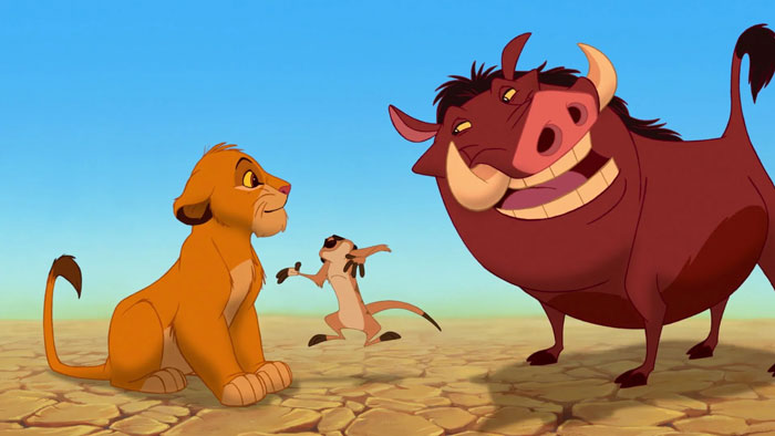 Pumbaa near Timon telling something to Simba 