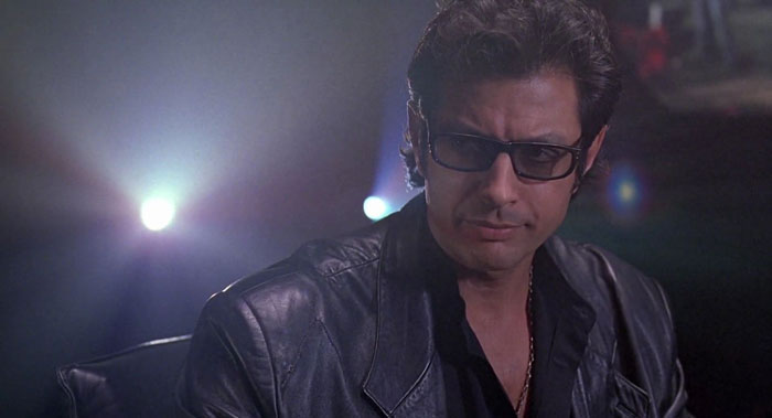 Dr. Ian Malcolm staring through dark glasses