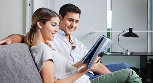 Image of couple reading magazine