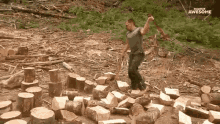 a man is standing in a pile of logs with an axe and a sign that says awesome in the background .