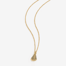 a gold necklace with a blue pendant on a white background