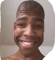 a man with a shaved head is smiling with his mouth open