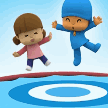 a boy and a girl jumping on a trampoline