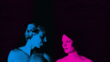 a man and a woman are standing next to each other in a blue and pink photo