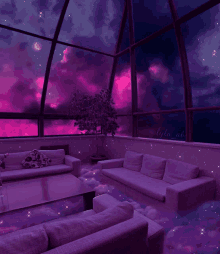 a living room with purple furniture and a purple sky behind it