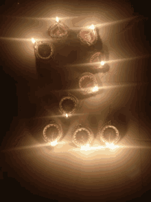 a group of candles are lit up in a row