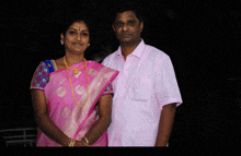 a man and a woman are posing for a picture together